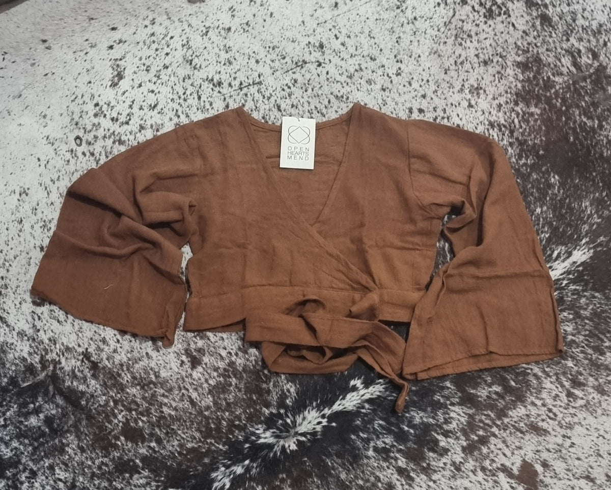  Hand-Dyed Cotton Wrap Tops from Open Hearts Mend, featuring sleeves and a waistline wrap design for sizes 8 to 12. Available in earthy hues reflecting natural beauty."