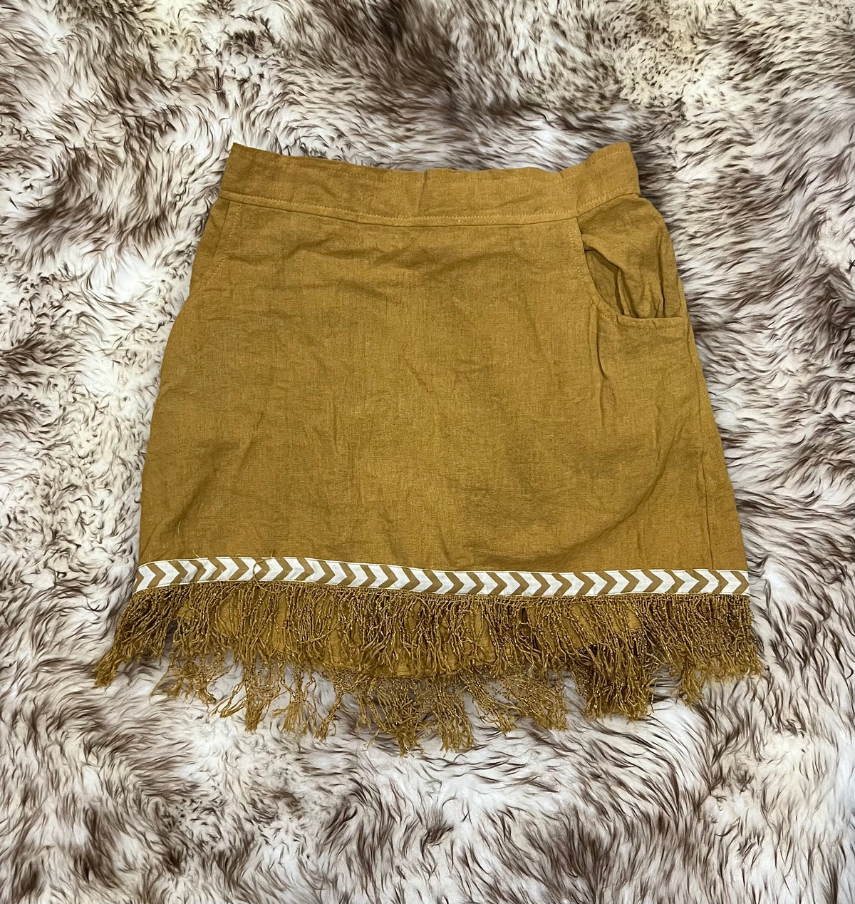 Cotton Mini Skirt with Frayed Edges from Open Hearts Mend, featuring soft and breathable cotton fabric, chic frayed hemline, and front pockets. Available in three stunning colors.