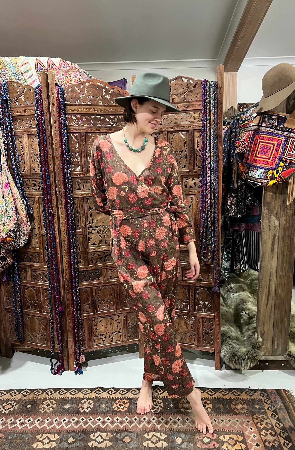 "Effortlessly chic Cotton Block Print Jumpsuit from Open Hearts Mend, featuring a low cross-way front, discreet button closure, and matching fabric belt, fits sizes 10 to 14, available in multiple colors including black and white."