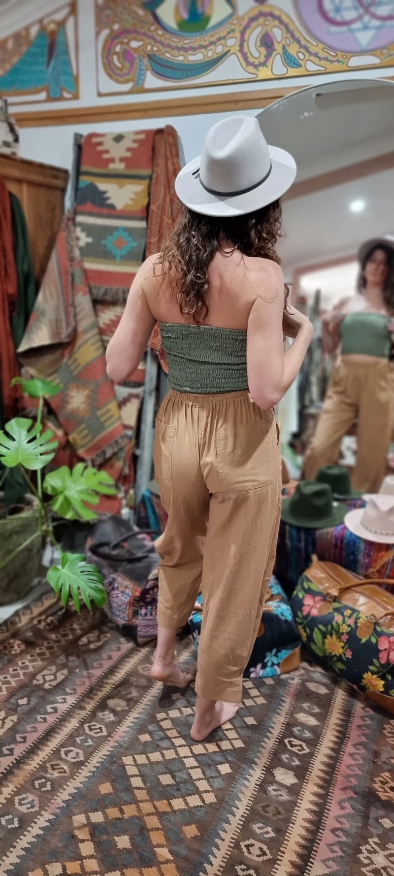 "Open Hearts Mend artisanal cotton/linen trousers with an elastic waistband, pockets, cropped silhouette, and hand-dyed finish for unique style and sustainability."