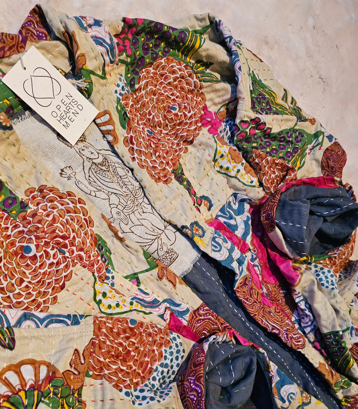 "Long cotton handsewn Kantha coat with stunning floral prints, unique small batch design, fits sizes 12-20."