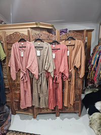 "Love Robes by Open Hearts Mend: Kimono-style rayon robes with 15 new season prints, side splits, pockets, and a belt, fitting sizes 10-18."