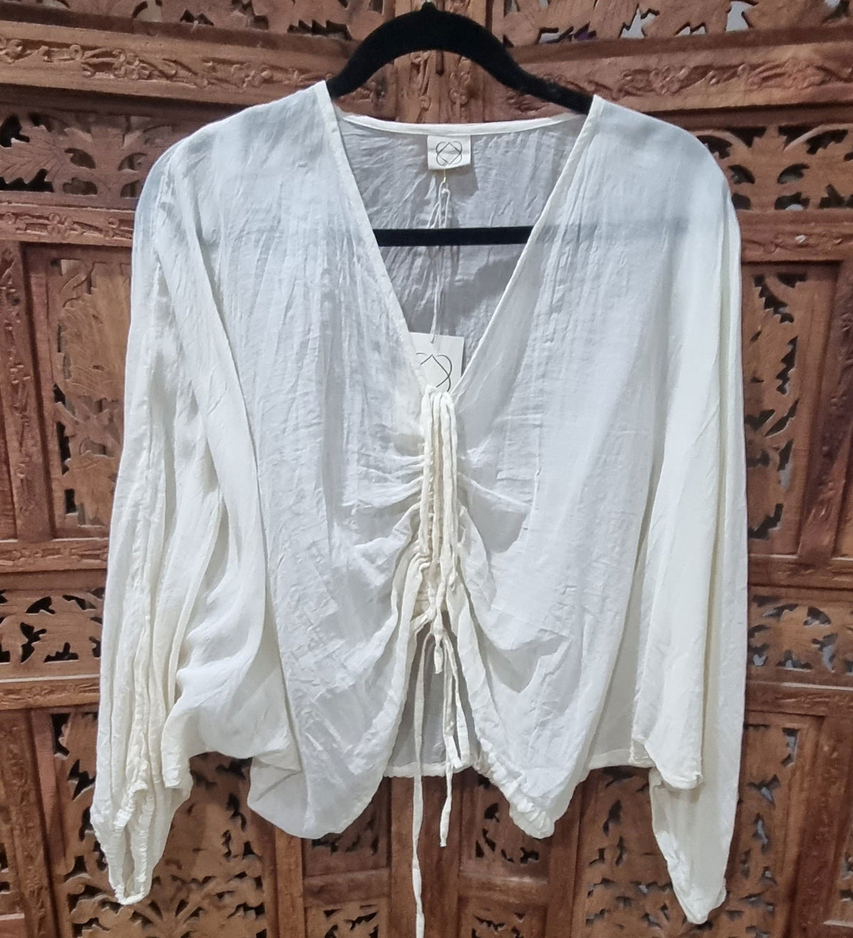 Sheer hand-dyed Indian cotton drawstring top with an adjustable fit, lightweight feel, and unique color variations, designed for effortless style and comfort.