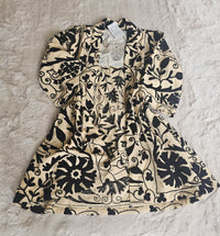 Hand-embroidered Suzani Taurus Flower Coat by Open Hearts Mend. Unique floral designs, outsize fit for sizes 10-20, one-of-a-kind craftsmanship. Perfect for adding artisanal elegance to your wardrobe.