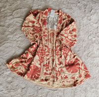 Hand-embroidered Suzani Taurus Flower Coat by Open Hearts Mend. Unique floral designs, outsize fit for sizes 10-20, one-of-a-kind craftsmanship. Perfect for adding artisanal elegance to your wardrobe.