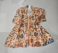 Hand-embroidered Suzani Taurus Flower Coat by Open Hearts Mend. Unique floral designs, outsize fit for sizes 10-20, one-of-a-kind craftsmanship. Perfect for adding artisanal elegance to your wardrobe.