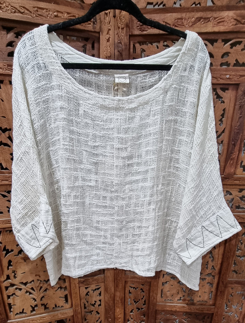 'Desert Dream' top from Open Hearts Mend, crafted from loose-woven hand-dyed cotton with zigzag sleeve finishing, fitting sizes 8 to 14.