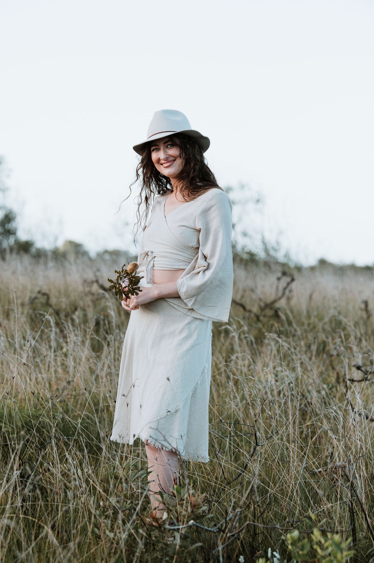  Hand-Dyed Cotton Wrap Tops from Open Hearts Mend, featuring sleeves and a waistline wrap design for sizes 8 to 12. Available in earthy hues reflecting natural beauty."