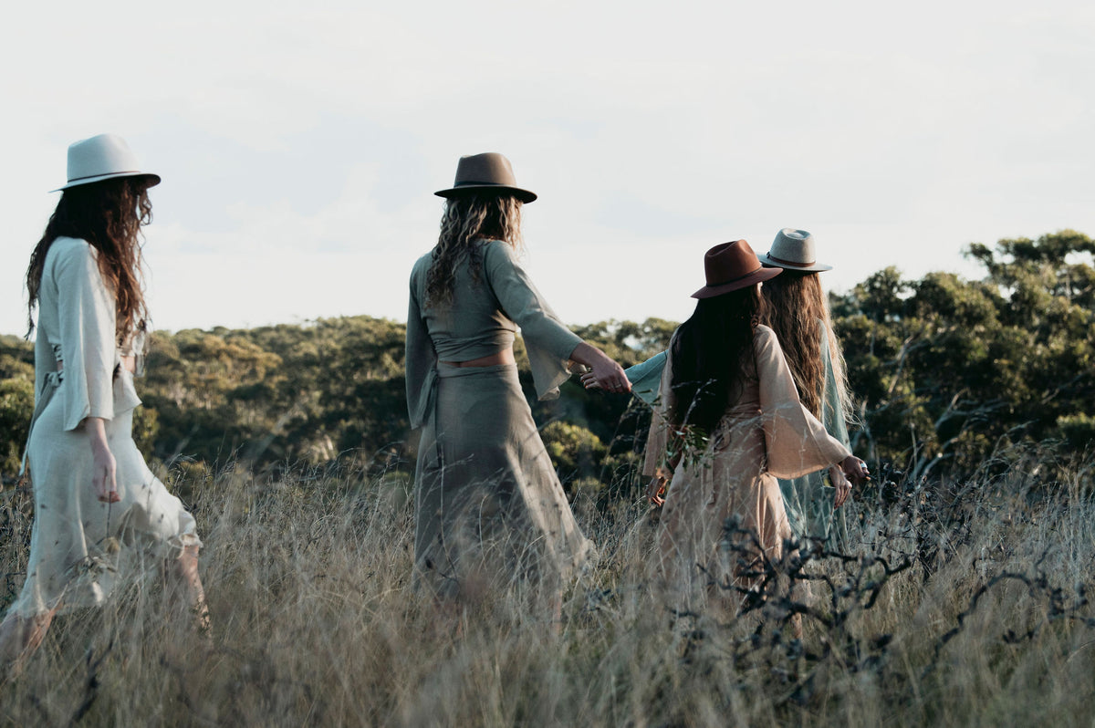  Hand-Dyed Cotton Wrap Tops from Open Hearts Mend, featuring sleeves and a waistline wrap design for sizes 8 to 12. Available in earthy hues reflecting natural beauty."